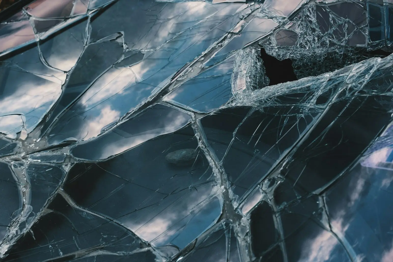 Broken auto glass close-up for glass replacement in West Melbourne